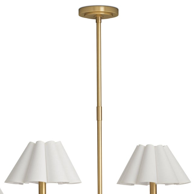 The Polly Chandelier embodies grace and versatility with its six shades, delicately crafted from white linen and sewn into...