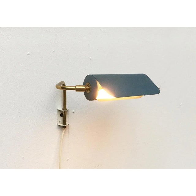 Mid-Century Swedish Minimalist Wall Lamp, in Very Good conditions. Designed 1960 to 1969 European Plug (up to 250V).The...