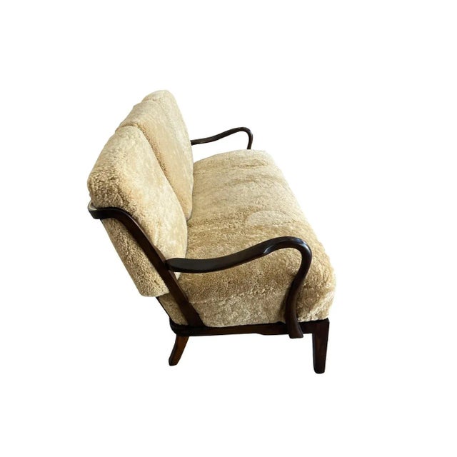 Charming 1940s Danish settee designed by Alfred Christensen for Slagelse Mobelvaerk. The frame is characterized by...