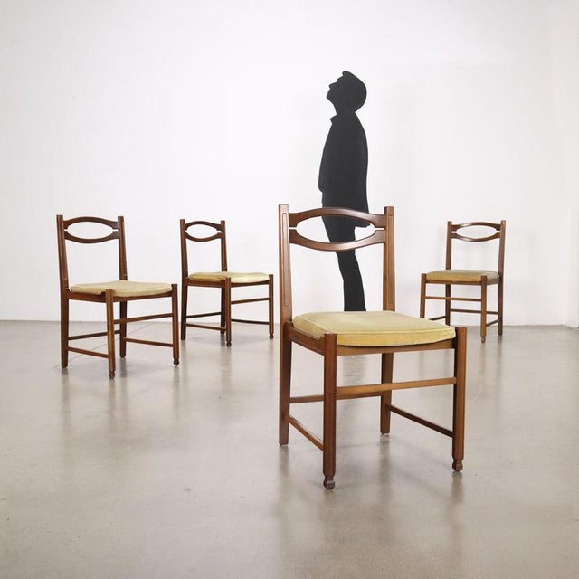 Chairs, stained beech wood, foam seat, velvet upholstery. Worn seat. This piece is attributed to the mentioned...