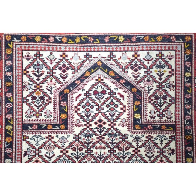 Hand-knotted prayer rug. Wool on cotton warp. Beautiful colors. Weaving density around 160,000 knots per m2. Double edge...