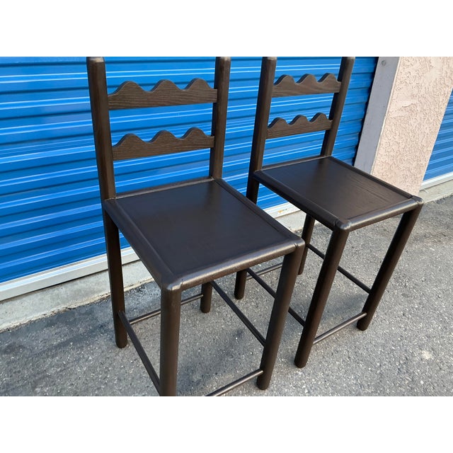 Set of 2 country French solid oak counter stools. Stools are done in a rich walnut finish. The stools were custom made....