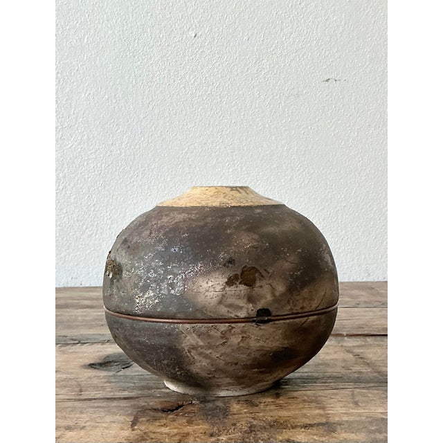This exceptional vintage studio pottery vase is a masterclass in Brutalist form and Wabi-Sabi philosophy. Crafted with a...