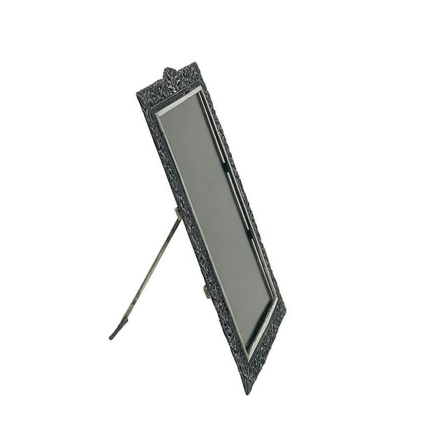 A Yogya silver picture frame, made in Indonesia, 1930s. The frame has the pattern with lotus flowers and leaves, made of...