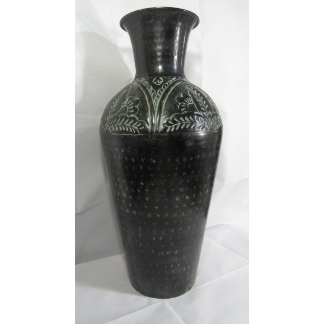 Charming metal vase, 20" tall, embossed with leaves and dots. There is something wonderful about a beautiful vase that...