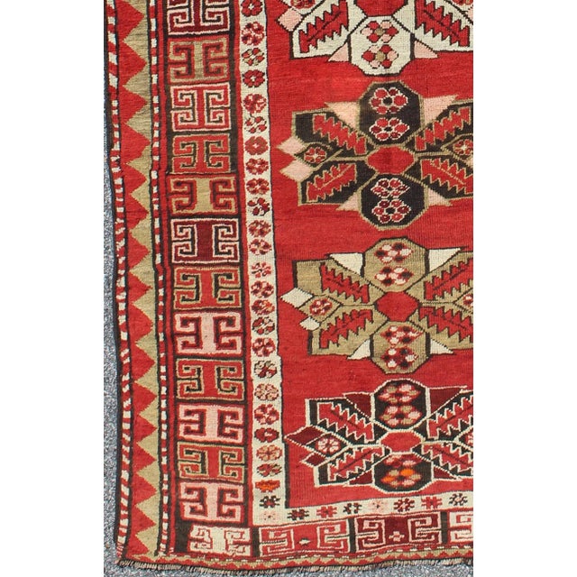 Tribal Antique Kazak Runner With Seven Medallions and Tribal Design in Red Background For Sale - Image 3 of 8