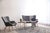 A hand-knotted wool rug, made in India and measuring 6' x 9'. Floral drawing carried across the field inside a traditional...