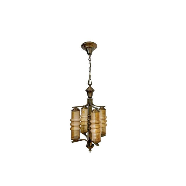 Unique Amsterdam School pendant lamp/ chandelier , 1920s–1930s. The lamp consists of a brass central stem with a geometric...