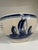 A charming vintage Delft Blue bowl dating to the 1950s, beautifully decorated with classic Dutch-inspired scenes in a rich...