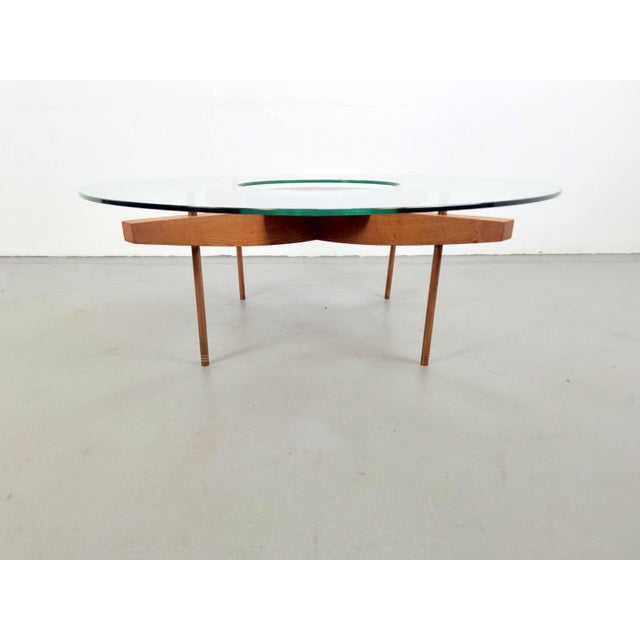 Round Glass Coffee Table with Wood X-Base, 1970, in Very Good conditions. Designed 1970 to 1979