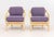 Pair of McGuire Twisted Rattan Arm Chairs, with purple upholstered cushions and "McGuire" label to underside. 31.5" H x...