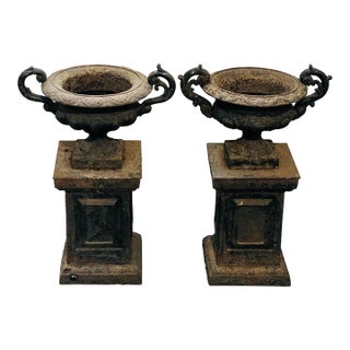 Antique Cast Iron Neo Classical Urns on Plinths a Pair For Sale