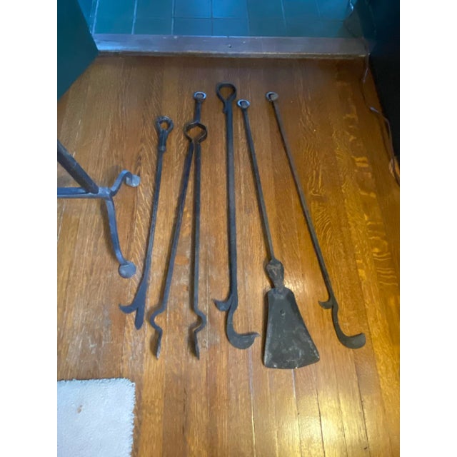 Stunning pair of intricate and heavy blacksmith hand forged andirons, circa late 1800's In excellent condition. 200 year...