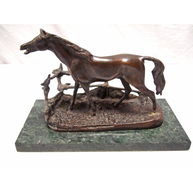 A Bronze of a Horse at a Barrier, a copy of the works of the French artist Pierre-Jules MÃªne. Mounted on a rectangular...