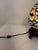 Beautiful vintage Tiffany style accent lamp featuring an iconic egg-shape shade. Hand-crafted with a brilliant mosaic...
