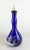 This gorgeous royal blue bottle will make a stunning display in any bar, restaurant or home collection. Attributed to Mary...