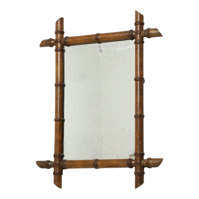 Antique faux bamboo mirror with its original weathered mirror plate and planked back, entirely in Chinoiserie style; this...