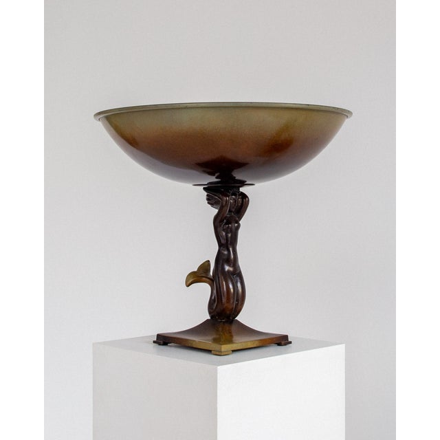 Large Art Deco bowl on foot, crafted by the prominent Swedish firm Ystad Brons in the 1930s. Cast in bronze with a rich...