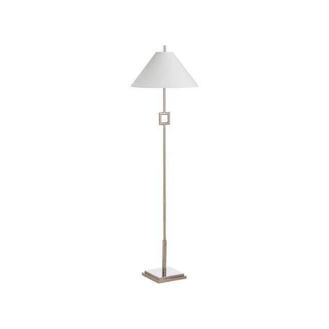 This sleek metal floor lamp features a modern silhouette with a bold square accent, adding a touch of architectural...