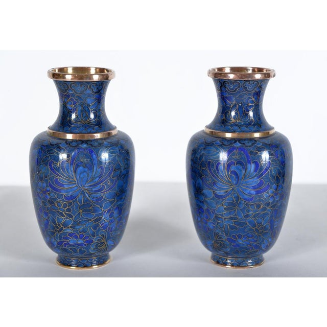 A captivating matched pair of small Japanese cloisonné posy vases from the Art Deco period, each one a miniature showcase...