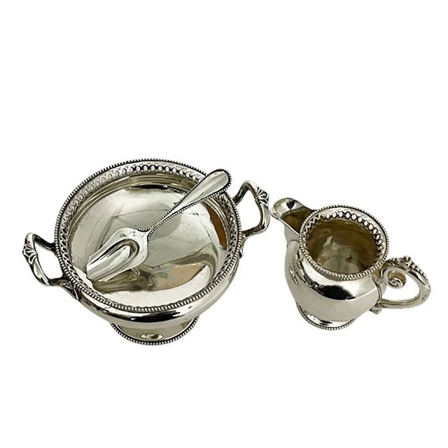 Dutch silver sugar and cream set, van kempen & zn, voorschoten, 1889. Silver sugar bowl, raised on a round foot and...
