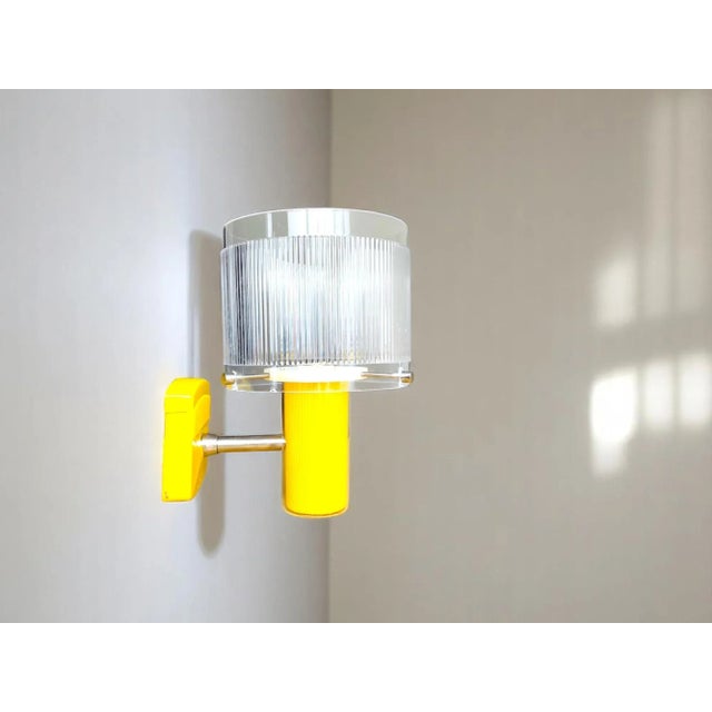 New vintage wall sconce. Made in portugal by vivaldi. it is made of plastic and acrylic material. The plastic base is in...