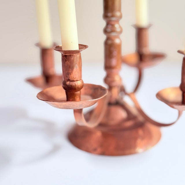 A substantial and beautifully crafted five-arm candelabra in hand-hammered copper, made in Mexico and stamped "Estados...
