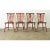 A charming set of four, circa 1890 English Windsor chairs made from oak with oxbow handrails at the top, connecting to...