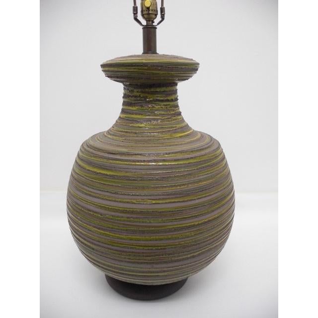 This marvelous, mid-century modern ceramic lamp definitely makes a statement with its large size and unique shape,...