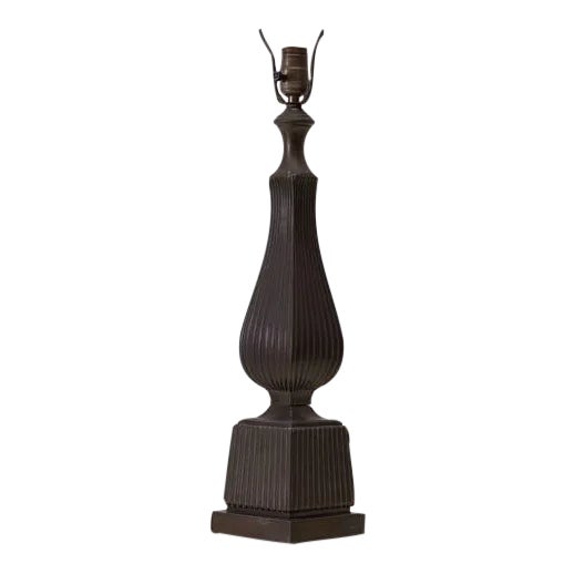 Stately deep bronze tone table lamp featuring a sinuous column shape atop a square base. Note the allover ribbed detail,...