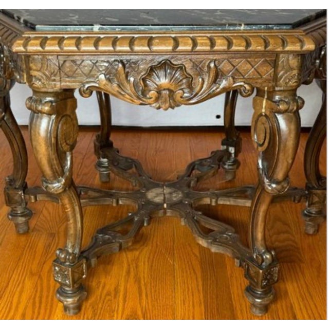 Vintage Italian Renaissance style carved walnut table featuring a hexagonal black Portoro marble top. Very substantial,...