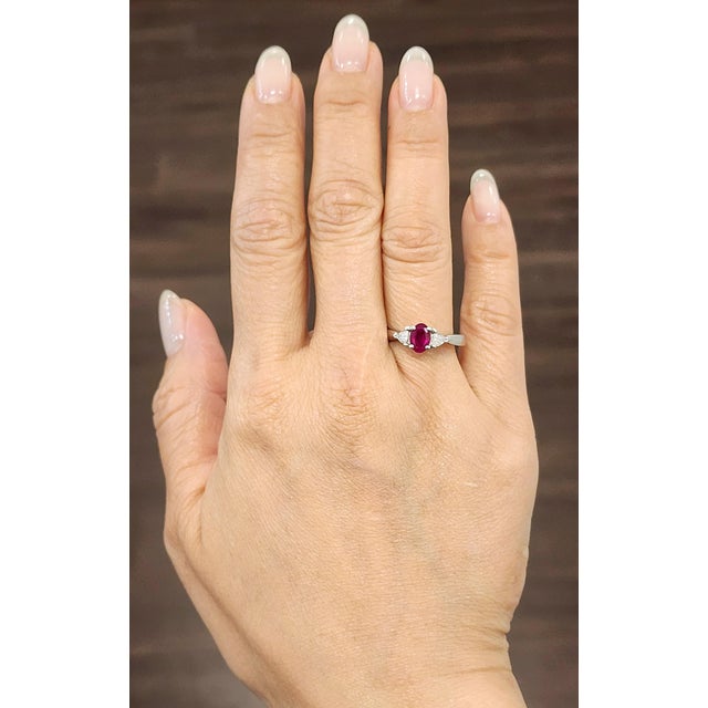 Adorn your finger with this stunning ruby and diamond ring, beautifully crafted in luminous platinum. At its center sits a...