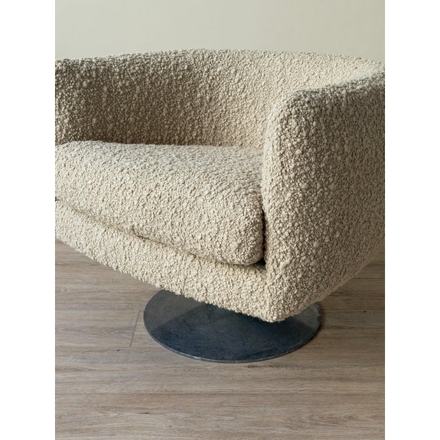 Vintage swivel lounge chair attributed to Milo Baughman for Thayer Coggin, featuring a rounded barrel back, integrated...