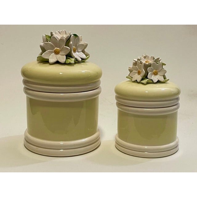 This sophisticated pair of mid-century ceramic lidded jars represents a compelling mid-20th-century Japanese...