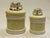 This sophisticated pair of mid-century ceramic lidded jars represents a compelling mid-20th-century Japanese...