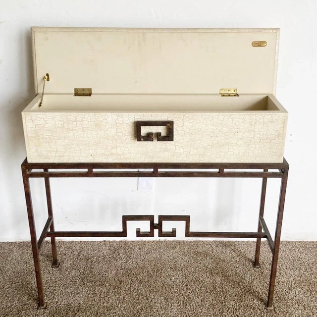Wonderful vintage chinoiserie console table/storage chest. Features a metal base with a wooden rectangular table top which...