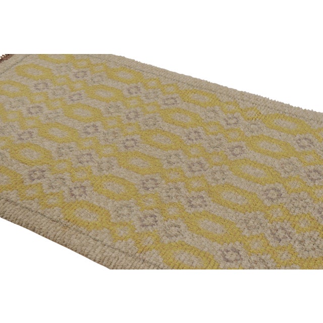 Hand-knotted in lush, high-pile wool in Sweden circa 1960-1970, this 4x7 vintage Swedish Rya rug is a bold new addition to...