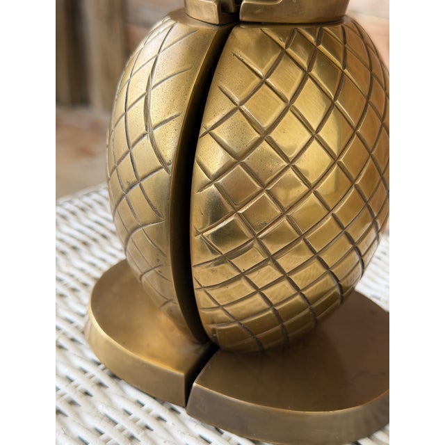 A fabulous pair of vintage solid brass pineapple bookends bringing all the Coastal Regency and Palm Beach charm. Featuring...