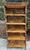 Gorgeous bamboo rattan five shelf étagère or bookcase made in the Hollywood Regency period. Beautifully crafted with...