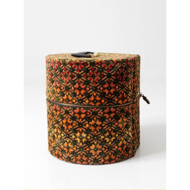 A 1960s Carry-All by Munro, distinguished by its richly patterned cut-velvet jacquard in an evocative palette of olive,...