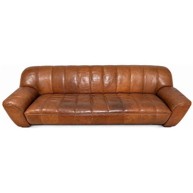 A unique, characterful original de sede ds-44 seating set with beautiful, thick, quilted, cognac-brown buffalo leather...