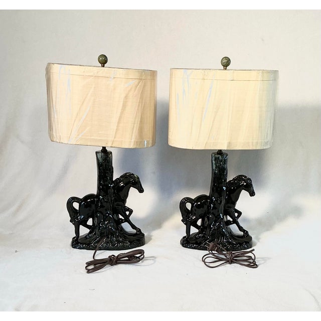 Matching pair of vintage Mid-Century Modern ceramic TV table lamps. These feature a figural design of a mare and colt...