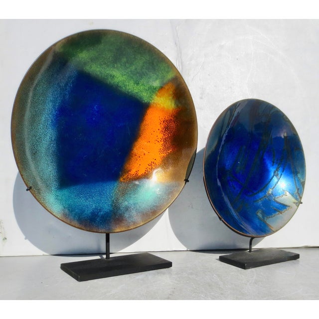 Beautiful mid-20th-century pair of bright enamel shallow bowls. Bright peacock blue dominates the pattern, and shades of...