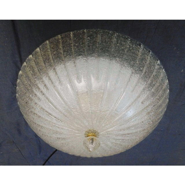 Italian flush mount with a Murano glass diffuser hand blown in Graniglia technique to produce granular texture, mounted on...