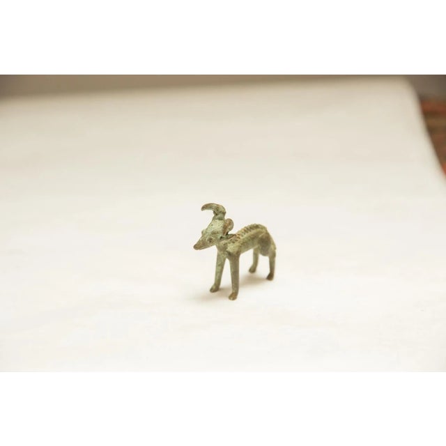 Vintage handmade African dark oxidized forward horn ram. Circa mid 20th century and possibly older, this piece has such...