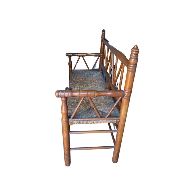 A charming and well-preserved early American country settee, likely late 19th century, with classic Maryland/Virginia...