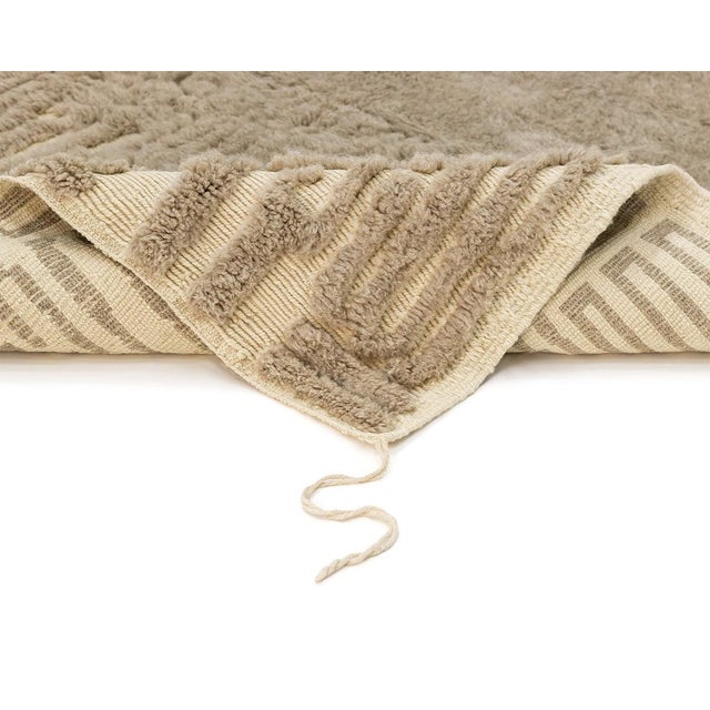 Sophisticated hand-knotted wool rug with a geometric pattern design in Misty Taupe and Velvet Fawn, offering a subtle yet...