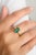 This stunning unisex statement ring features a captivating 1.82ctw octagon-cut emerald, set in a sleek design that...