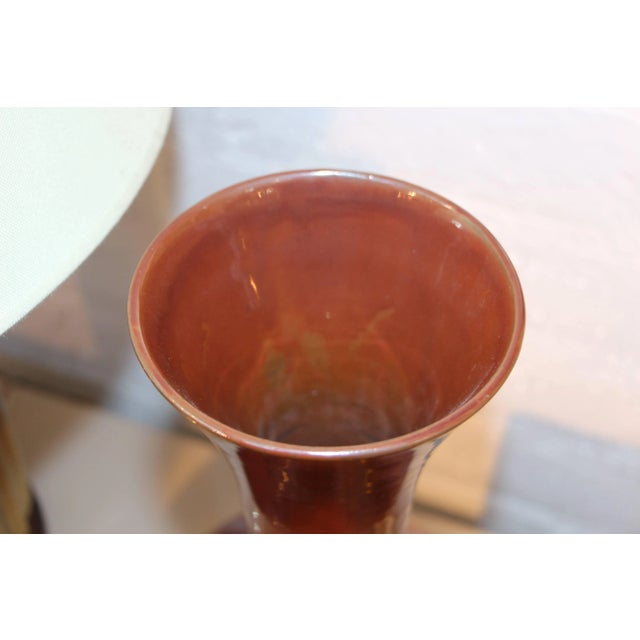 A pretty Asian probably Chinese early 20th century iron oxide glazed Vase. It bears a Steve Chase inventory label with a...