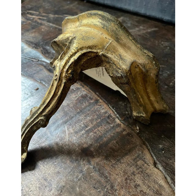 Lovely Italian wall shelf (wall sconce), presented in a gilt gold, it is solid wood. Classic and timeless , carved gently...
